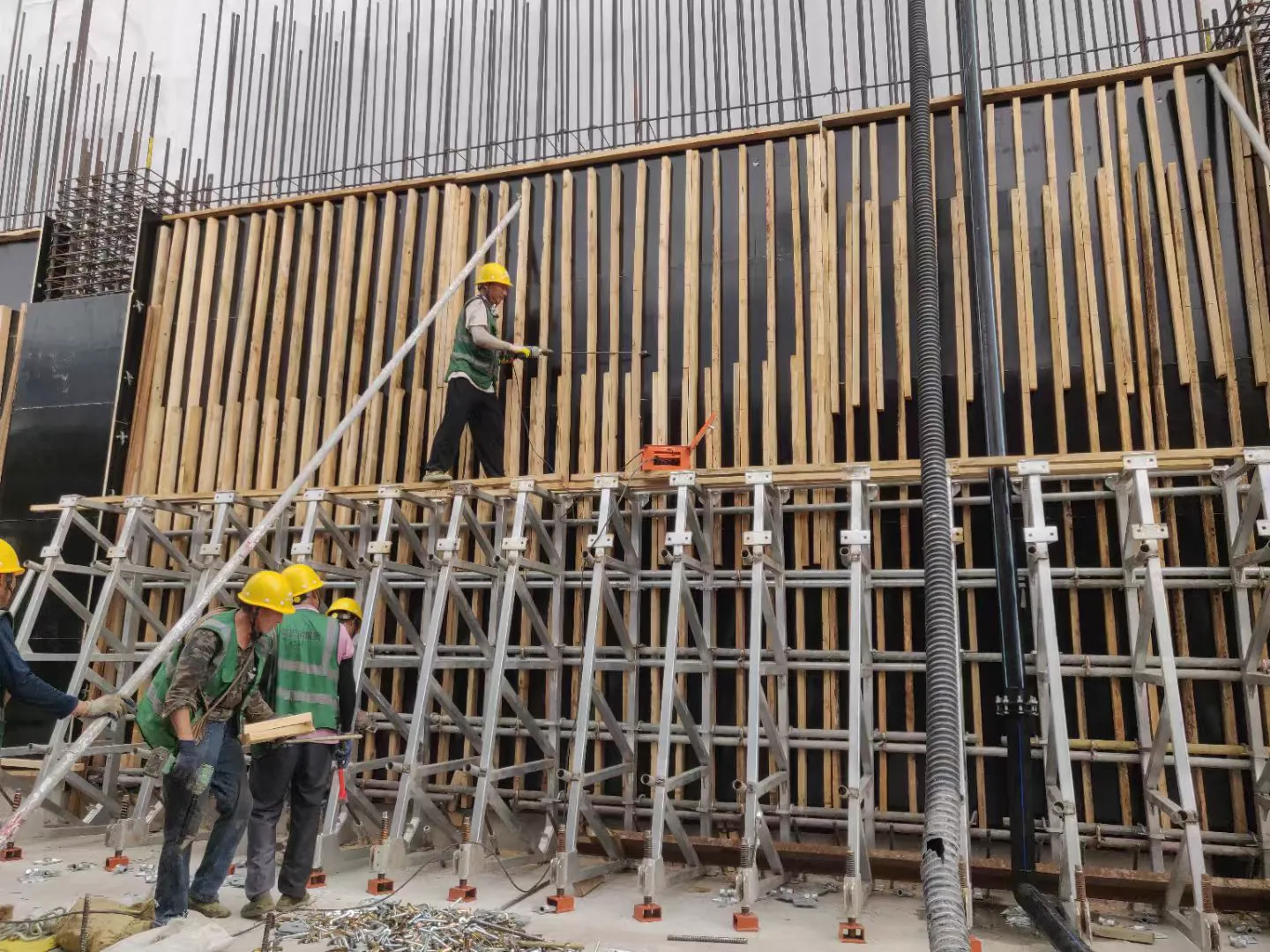Workers assembling timber formwork